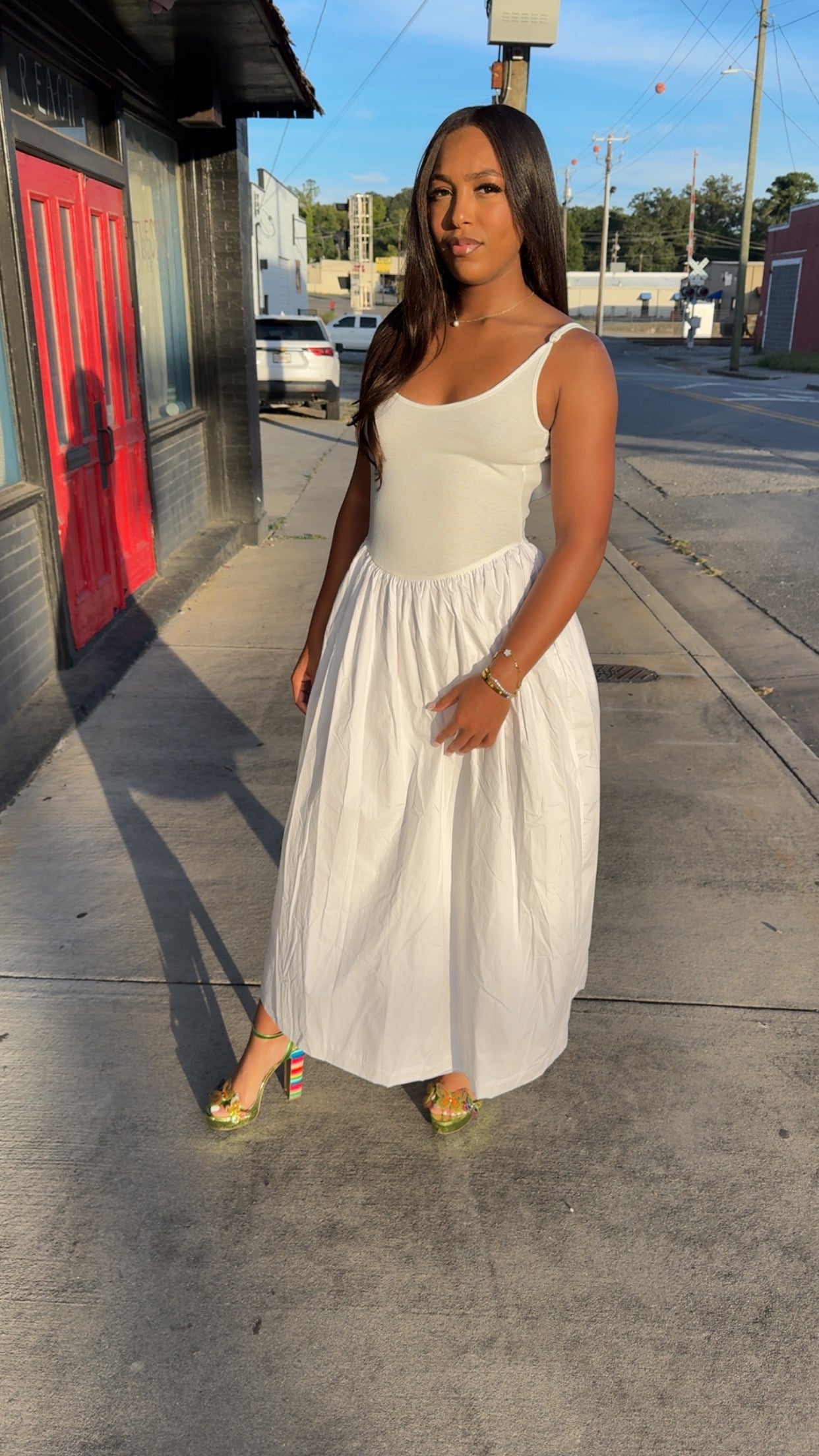 White low back dress with pockets.